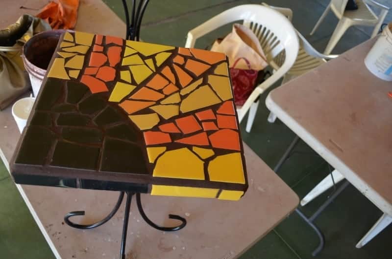 Mosaic table grouted with brown grout