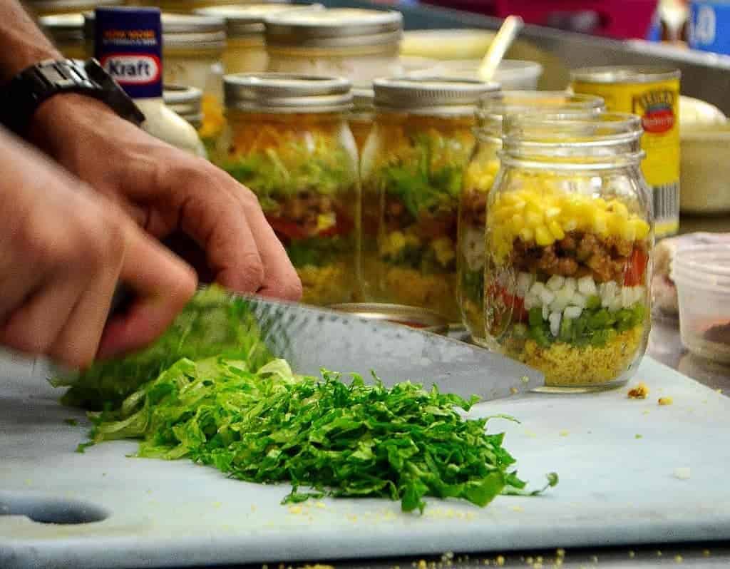 Chef Storey serves his Corn Bread Salad in large Mason jars. What a great idea for a picnic!