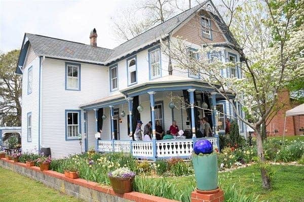 Guests wait to go in a home on Historic Garden Week Tour, West Point, Virginia