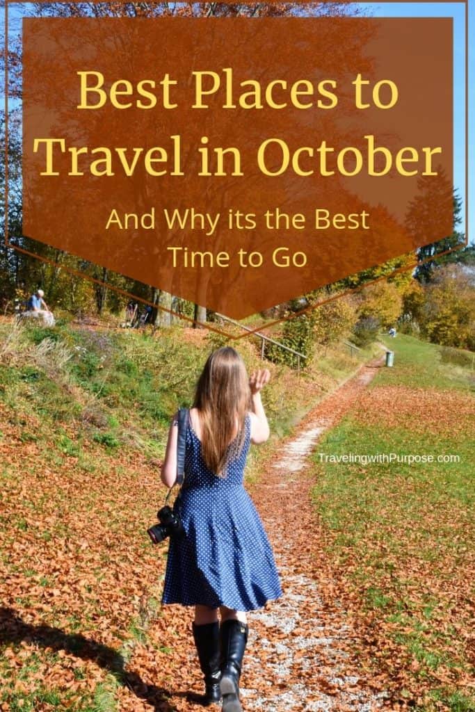 Best Places to Travel in October - rear view of young woman walking along trail among autumn leaves, a camera hanging from her shoulder