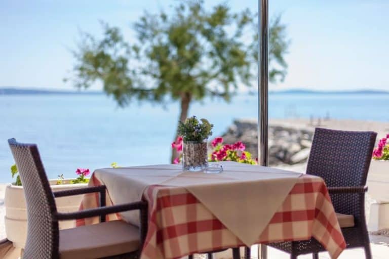 Amigos Restaurant with Outdoor seating on the Patio Podstrana, Adriatic Sea in the background