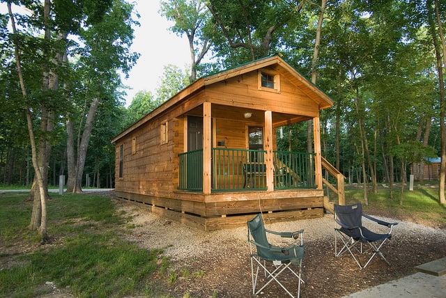 Log cabin with camping chairs at Twain State Park Missouri