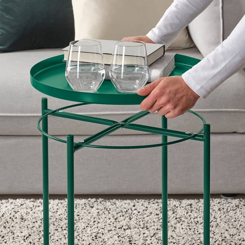 Person lifting tray from Ikea Gladom Green Side table with removable tray 