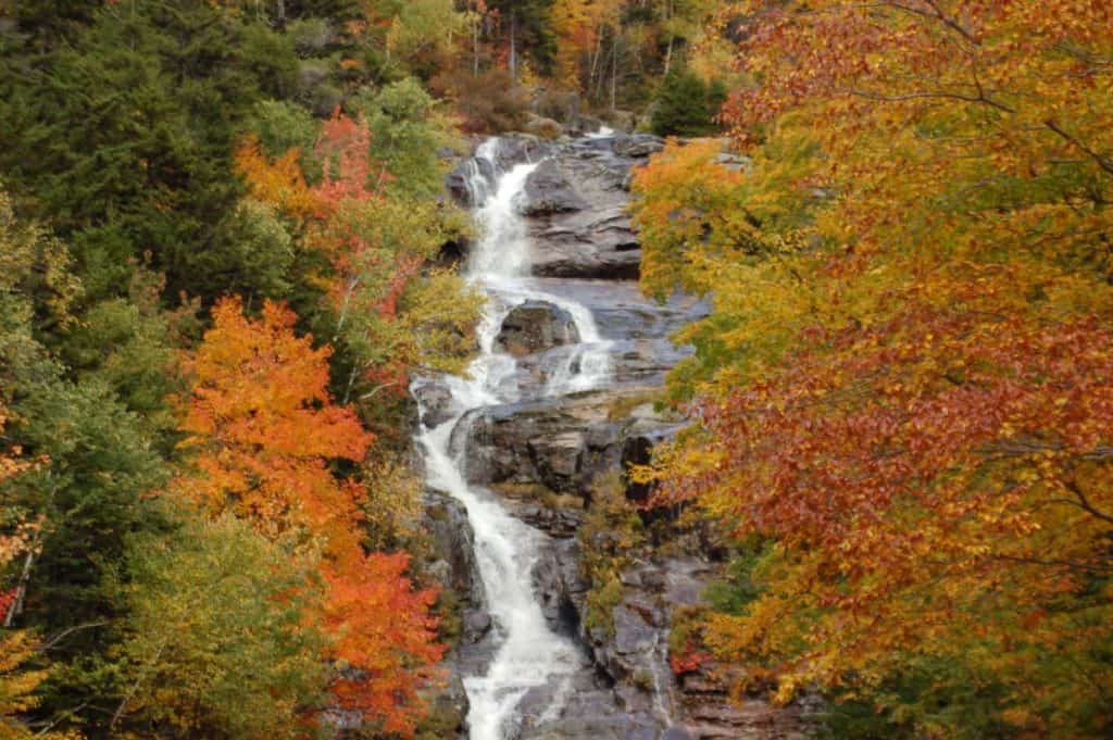 New Hampshire Waterfall surrounded by fall leaves