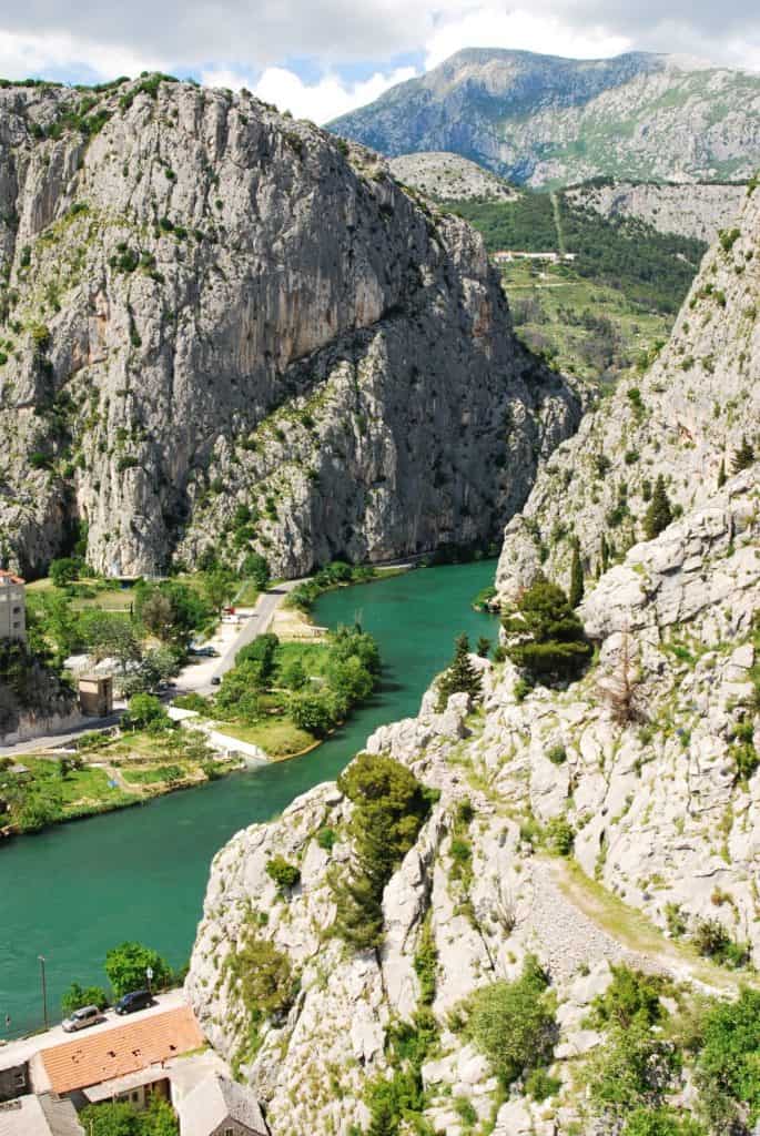 Turquoise water of Cetina River and cliffs Omis Croatia