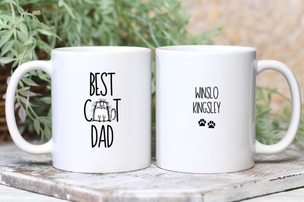 Cat Dad coffee mug with cats' names on the back