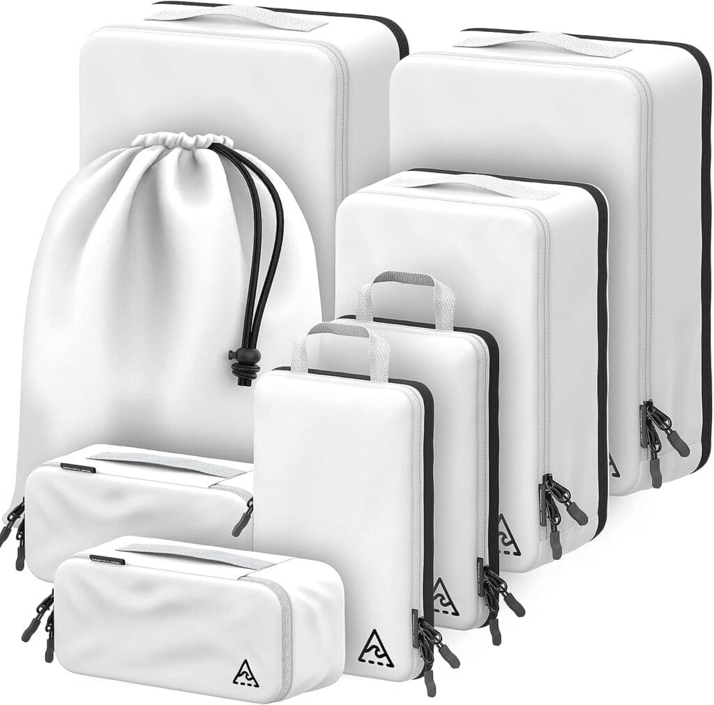 Set of 8 white travel packing cubes of various sizes and a drawstring laundry bag