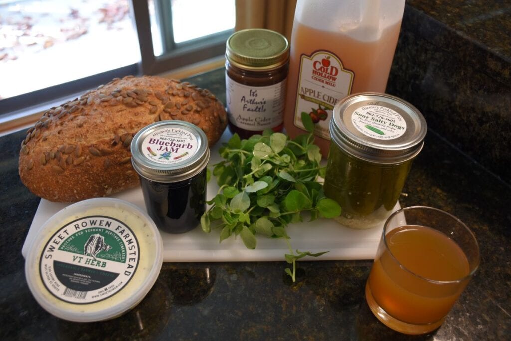 Fresh load of bread, homemade jam, Vermont cheese spread, fresh apple cider and greens from the Stowe Vermont Farmers Market