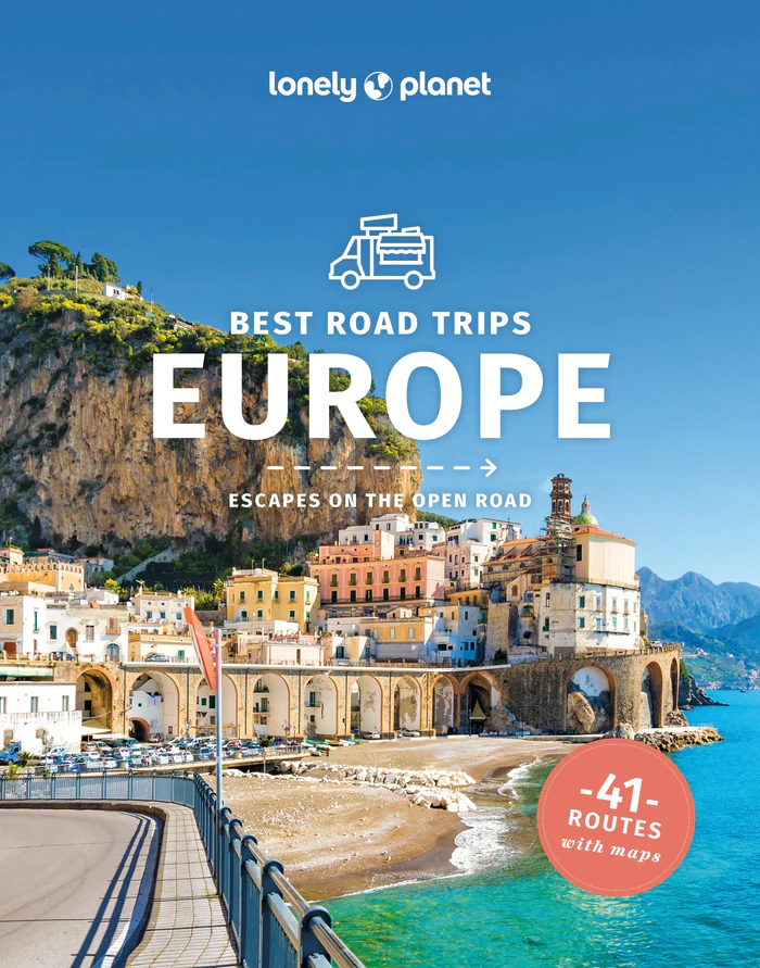 Cover of a Lonely Planet guidebook for "Best Road Trips Europe" Background image is a historic coastal city with the beach and ocean in the foreground. One of many great travel resources by Lonely Planet publishers