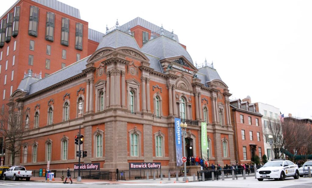 The 2-story Renwick Gallery in Washington DC on the corner of Pennsylvania Avenue NW is a National Historic Landmark. It was built in the mid-1800s expressly as an art museum. The first of its kind in the U.S. It's built in the Second Empire style of red brick with ornate columns, arched windows and intricate stone trim.