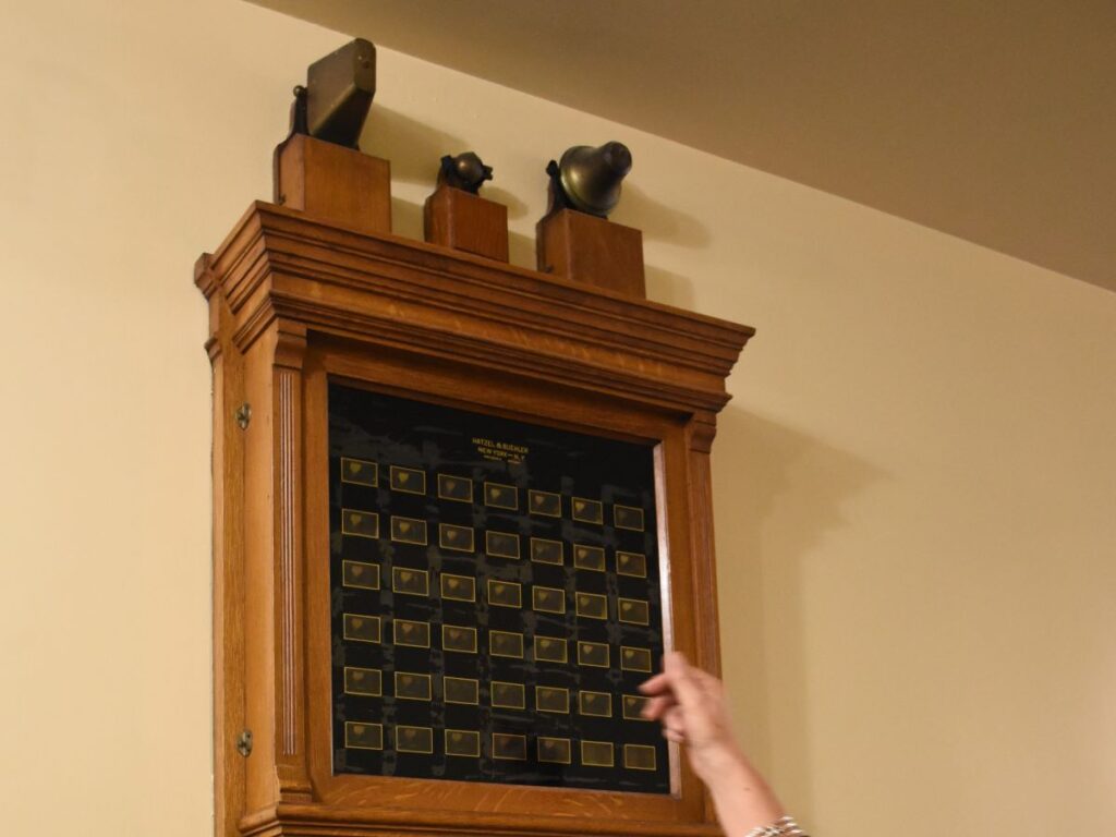 This wooden servants' call box with numbers for each room hangs on the wall in the basement. The family used similar boxes connected in each room of the mansion to call the servants when needed - the Elms Mansion, Newport, Rhode Island